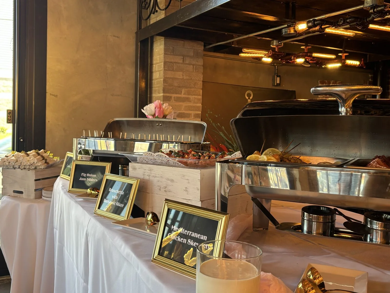 Catered event presentation with fresh dishes and elegant setup